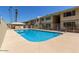 Sparkling community pool surrounded by well-kept grounds, offering a refreshing escape for residents at 2605 W Rose Ln # B101, Phoenix, AZ 85017