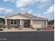 Charming single-story home with a two car garage, neutral color scheme and gravel landscaping at 26388 N 77Th Dr, Peoria, AZ 85383
