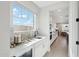 Modern butler's pantry featuring sleek countertops, ample cabinet space, and a convenient wine cooler at 26388 N 77Th Dr, Peoria, AZ 85383