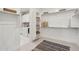 Spacious walk-in closet with built-in shelving and storage solutions, laundry area is in the background at 26388 N 77Th Dr, Peoria, AZ 85383