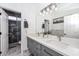 Stylish bathroom with double vanity, marble countertops, and a marble tiled shower at 2737 W Eastman Dr, Anthem, AZ 85086