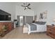 Bedroom with ceiling fan, wood floors, neutral colors, and lots of natural light at 2737 W Eastman Dr, Anthem, AZ 85086