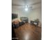 Bedroom featuring hardwood flooring and ceiling fan and built-in desk at 2845 E Beck Ln # 3, Phoenix, AZ 85032