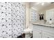 Bathroom featuring floral shower curtain, toilet, and granite vanity with a large mirror at 2975 E Tulsa St, Gilbert, AZ 85295