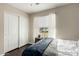 Bedroom featuring sliding closet doors, and a window with views of the exterior at 2975 E Tulsa St, Gilbert, AZ 85295
