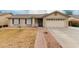 Charming single-level home featuring a tile roof and a well-maintained front yard at 2975 E Tulsa St, Gilbert, AZ 85295