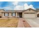 Charming single-level home featuring a tile roof and a well-maintained front yard at 2975 E Tulsa St, Gilbert, AZ 85295