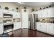 Modern kitchen featuring white cabinets, stainless steel appliances, and granite countertops at 2975 E Tulsa St, Gilbert, AZ 85295