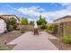 A beautifully landscaped backyard with a brick patio, ideal for entertaining and outdoor living at 3143 N Evergreen St, Buckeye, AZ 85396