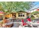 Outdoor space with fire pit, lounge chairs and shade trees, perfect for entertaining and relaxation at 3143 N Evergreen St, Buckeye, AZ 85396