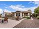 Cozy backyard featuring a brick patio, drought-resistant landscaping, and a private outdoor space at 3143 N Evergreen St, Buckeye, AZ 85396