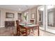 Dining area with a view to the patio, wood furniture, and marble floors at 3143 N Evergreen St, Buckeye, AZ 85396