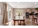 Dining area featuring a window and glass paneled door next to the kitchen at 3143 N Evergreen St, Buckeye, AZ 85396