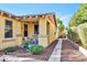 Inviting home exterior with stone accents, a charming porch, and a well-manicured walkway leading to the entrance at 3143 N Evergreen St, Buckeye, AZ 85396
