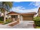 Beautiful single-story home featuring mature landscaping, a spacious driveway, and a two-car garage at 3143 N Evergreen St, Buckeye, AZ 85396