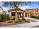 Charming home exterior featuring a well-manicured lawn and covered front porch at 3143 N Evergreen St, Buckeye, AZ 85396
