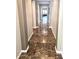 Elegant hallway featuring polished marble flooring with neutral-toned walls and recessed lighting at 3143 N Evergreen St, Buckeye, AZ 85396