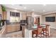 Kitchen featuring tile flooring, an island with bar seating, and stainless steel appliances at 3143 N Evergreen St, Buckeye, AZ 85396