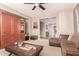 Comfortable living room featuring neutral tones, ceiling fan and carpeted flooring at 3143 N Evergreen St, Buckeye, AZ 85396