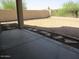 Backyard of the property featuring a large, open dirt area and block wall fencing at 32020 N 23Rd Ave, Phoenix, AZ 85085