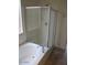 Bathroom showcasing a clean bathtub and shower with a glass enclosure at 32020 N 23Rd Ave, Phoenix, AZ 85085