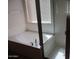 A bathtub and shower in the bathroom of the home with shower door at 32020 N 23Rd Ave, Phoenix, AZ 85085