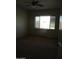 Bright bedroom features a ceiling fan and a window offering natural light at 32020 N 23Rd Ave, Phoenix, AZ 85085