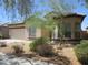 Charming single-story home featuring a well-maintained yard with desert landscaping and an attached two-car garage at 32020 N 23Rd Ave, Phoenix, AZ 85085