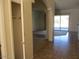 Hallway features stylish tiled flooring, archways, and access to multiple rooms at 32020 N 23Rd Ave, Phoenix, AZ 85085
