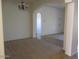 Spacious living room featuring arched doorway and light color paint, providing ample natural light at 32020 N 23Rd Ave, Phoenix, AZ 85085