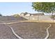 Large, flat backyard, enclosed with a block wall, perfect for customization and outdoor enjoyment at 41176 N Cambria Dr, San Tan Valley, AZ 85140