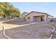 Spacious backyard with a covered patio and block wall fence providing privacy at 41176 N Cambria Dr, San Tan Valley, AZ 85140