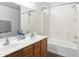 Bright bathroom with double sink vanity, soaking tub and shower combination at 41176 N Cambria Dr, San Tan Valley, AZ 85140