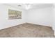 Bedroom with carpet, neutral walls, and a window letting in natural light at 41176 N Cambria Dr, San Tan Valley, AZ 85140