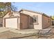 Exterior view featuring an attached two-car garage and low-maintenance landscaping at 41176 N Cambria Dr, San Tan Valley, AZ 85140
