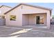 Covered patio, exterior window and sliding door leading to the backyard, perfect for outdoor entertaining at 41176 N Cambria Dr, San Tan Valley, AZ 85140