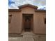 Inviting front entryway with a covered porch and a decorative wreath on the front door at 41176 N Cambria Dr, San Tan Valley, AZ 85140