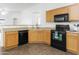 Modern kitchen with ample counter space, updated appliances, and an open design for easy entertaining at 41176 N Cambria Dr, San Tan Valley, AZ 85140