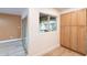 Bright dining room with natural light, wood-look floors, and built-in cabinets at 4201 E Camelback Rd # 28, Phoenix, AZ 85018