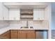 Close up on kitchen countertops featuring stainless steel dishwasher and stylish cabinets at 4201 E Camelback Rd # 28, Phoenix, AZ 85018