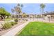 Community pool area offers lush landscaping, barbecue grills, and seating for outdoor enjoyment at 4201 E Camelback Rd # 28, Phoenix, AZ 85018