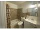 Bathroom with a shower-tub combo and white vanity at 4231 N 69Th Ln # 1325, Phoenix, AZ 85033