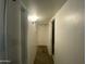 Bright hallway with neutral walls and carpeted floors at 4231 N 69Th Ln # 1325, Phoenix, AZ 85033