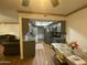 Well-equipped kitchen featuring stainless steel appliances, modern cabinetry, and a cozy dining area at 4231 N 69Th Ln # 1325, Phoenix, AZ 85033