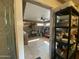 View into a large storage area with tile flooring and a ceiling fan at 4231 N 69Th Ln # 1325, Phoenix, AZ 85033