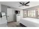 Bedroom featuring a ceiling fan, a large window and neutral walls and carpet at 4558 E Rock Wren Rd, Phoenix, AZ 85044