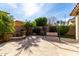 Serene backyard featuring a water feature, comfortable swing, and beautifully manicured landscaping for relaxation at 4727 S Watauga Dr, Gilbert, AZ 85297