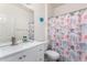 Well-lit bathroom featuring a vanity with counter space, a mirror, and a shower with a curtain at 4727 S Watauga Dr, Gilbert, AZ 85297