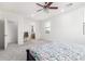 Neutral carpeted primary bedroom showcasing access to the connected bathroom and ceiling fan at 4727 S Watauga Dr, Gilbert, AZ 85297