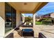 Inviting covered patio with comfortable seating area, perfect for outdoor relaxation and entertaining at 4727 S Watauga Dr, Gilbert, AZ 85297